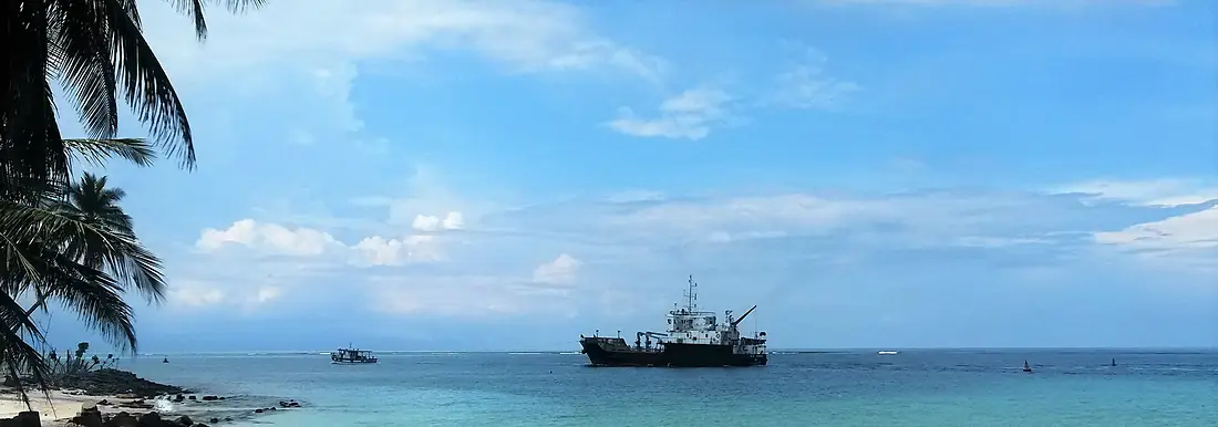 A Tug toying the Barge