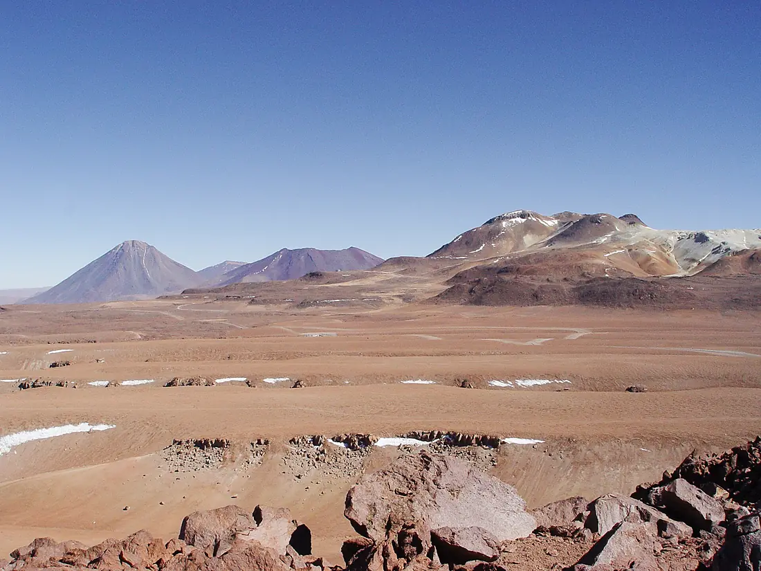 A view across the plains of Chajnantor with the ALMA construction site at the centre